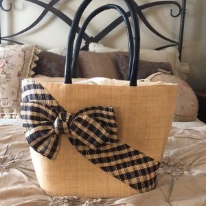 Woven grass purse with large bow